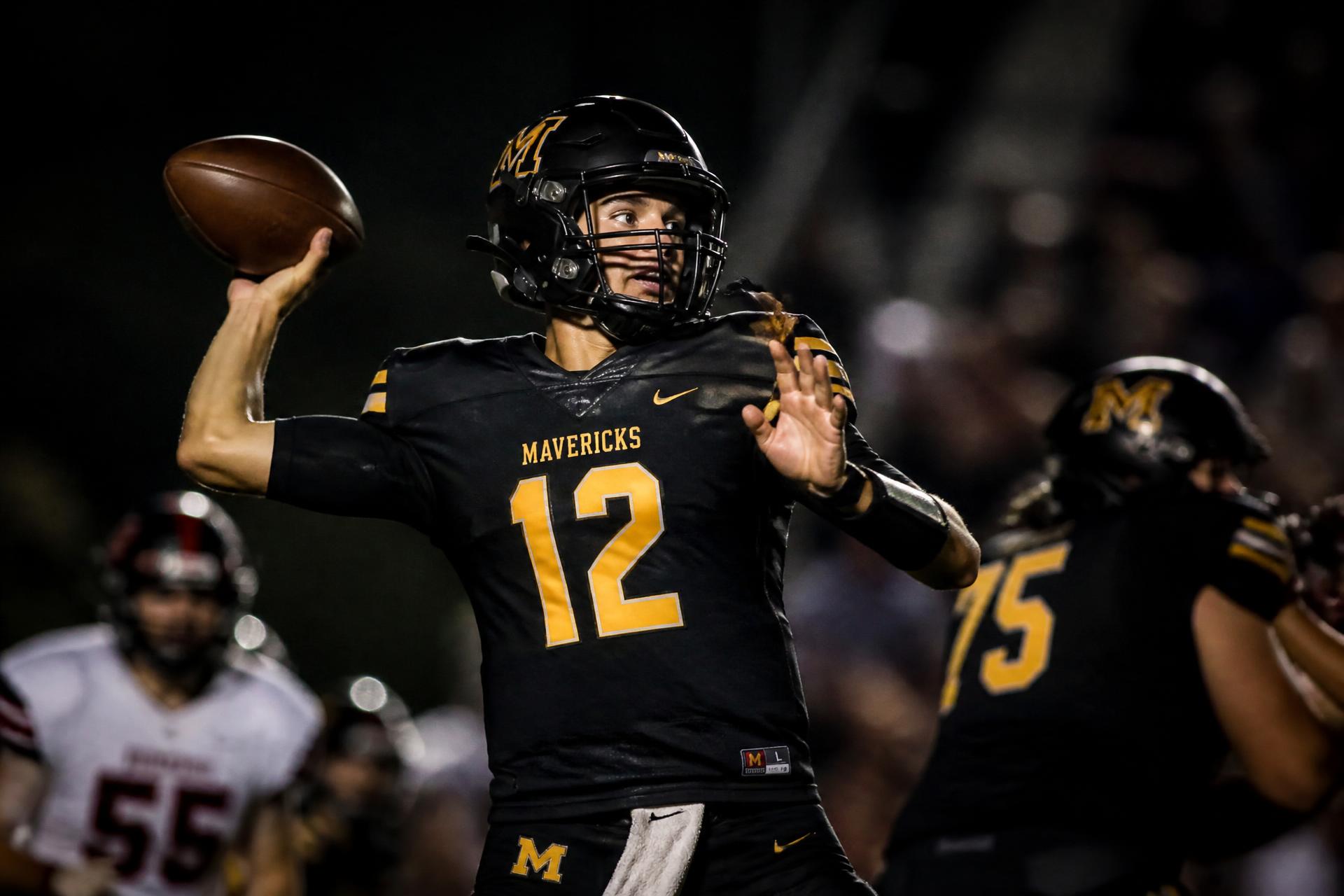 Friday night high school football under stadium lights